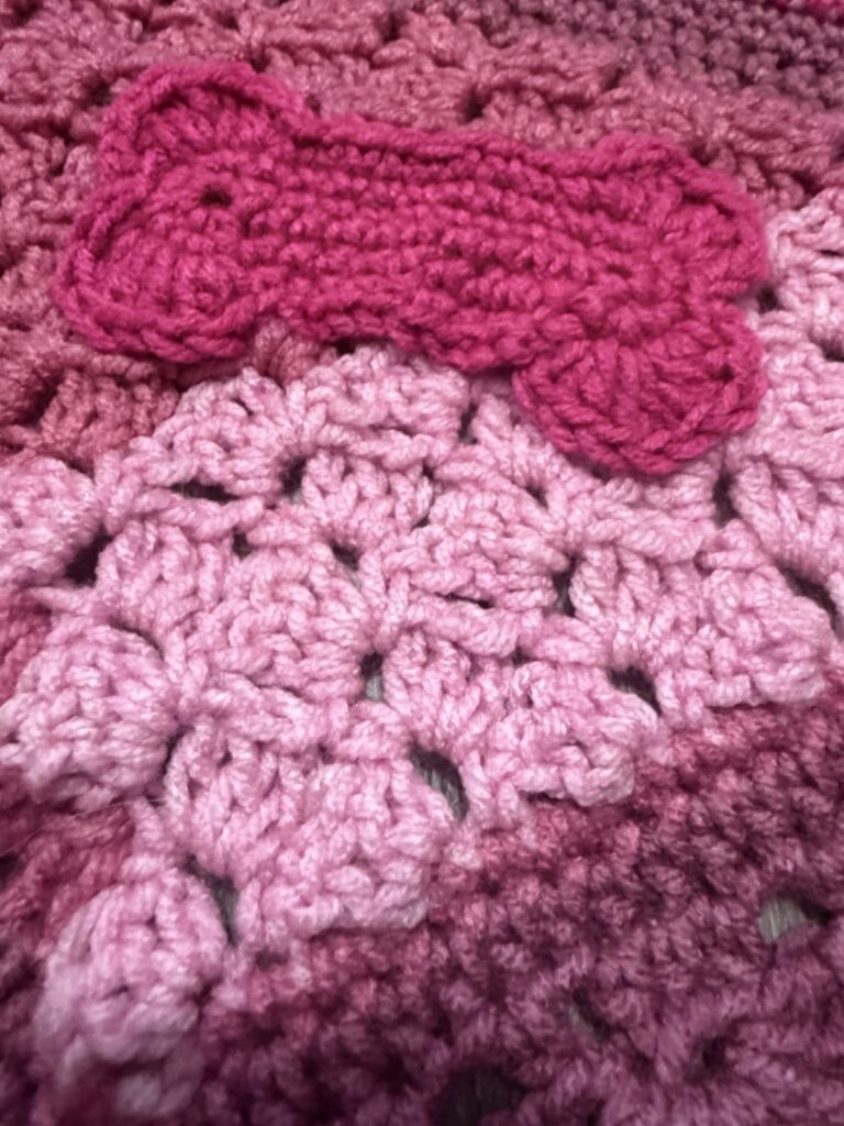 Close-up of textured crochet pet bandana craftsmanship