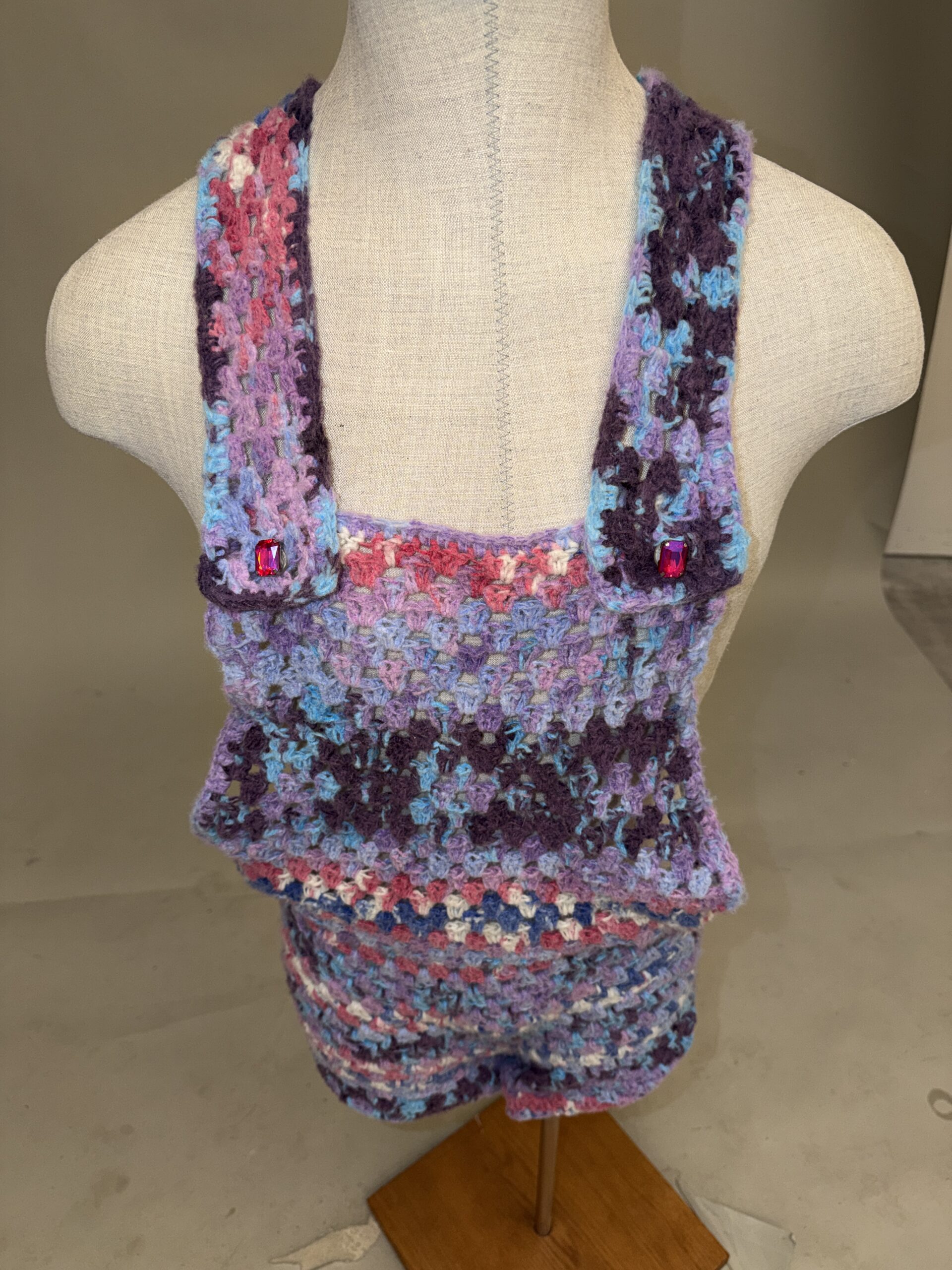 Men’s Jeweled Crochet Romper – IMG 6466 Men’s jeweled crochet romper in purple, pink and blue variegated yarn